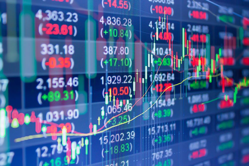Stock market chart with fluctuating numbers and graphs on a digital screen indicating financial trading dynamics.